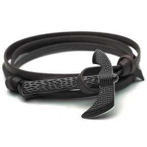 Brown leather wrap bracelet featuring a black hammer-textured metal axe clasp on white