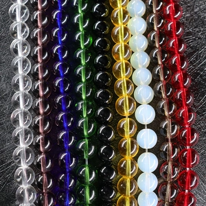 Vibrant round crystal glass beads in various colors for DIY jewelry making and crafting