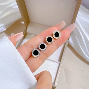 Titanium steel gold and silver round stud earrings with black disk and pavé crystals