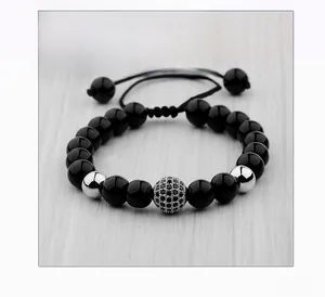 Detail shot of 8mm zircon bead on a black beaded bracelet with silver accents