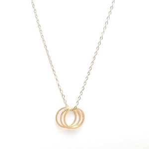 Minimalist gold necklace featuring three interlocking circles on a fine chain jewelry