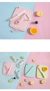 Three-piece ceramic knife set with cutting board and peeler in pink blue and green