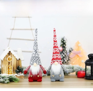 Detailed view of red and grey Christmas faceless gnomes with long hats and striped bodies
