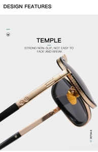 Detailed close-up of metal hinges and knurled texture on modern gold and black sunglasses