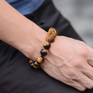 Natural tiger eye stone beaded bracelet for men featuring a hand-carved Pixiu charm
