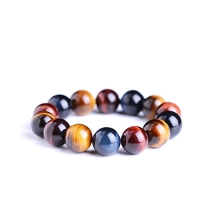 Natural tiger eye stone beaded bracelet with glossy round beads and golden textures