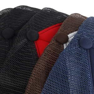 Detailed macro view of honeycomb mesh structure and top buttons on breathable mesh caps