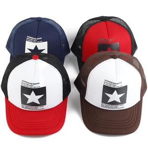 Detail of four multi-color mesh trucker hats with star print and breathable net back