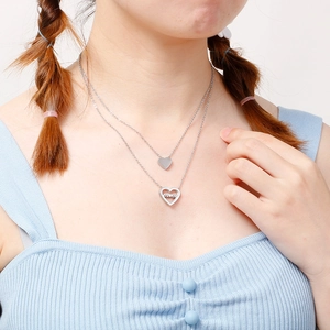 Double-layer silver heart necklace for women featuring a Mom pendant on a model