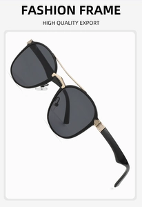 Detail view of double bridge aviator sunglasses with gold metal hinges and black frame