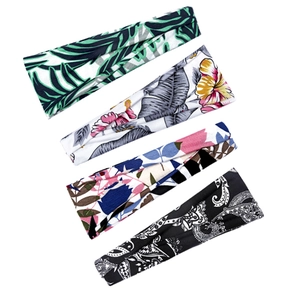 Set of four wide elastic yoga headbands with floral prints on a white background