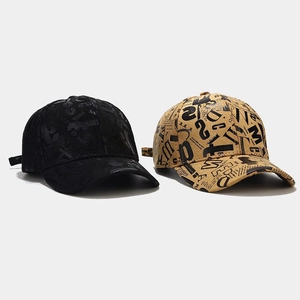 Detail of graffiti letter prints on black and khaki cotton baseball caps for women
