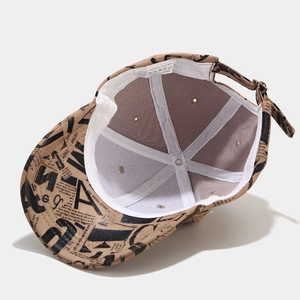 Detail view of khaki baseball cap interior showing white wash label and stitching