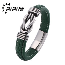 Close-up of green braided leather bracelet with silver magnetic buckle on white background