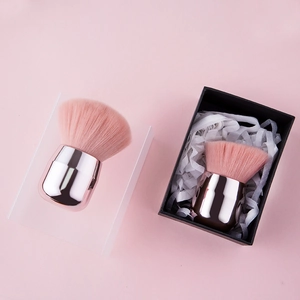 Pink mushroom makeup brush with rose gold handle and elegant black gift box packaging