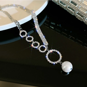 Sparkling rhinestone hoop and pearl necklace with a layered silver-tone chain