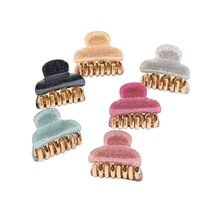 Mini acrylic hair claws set with glitter finish and gold metal teeth in six assorted colors