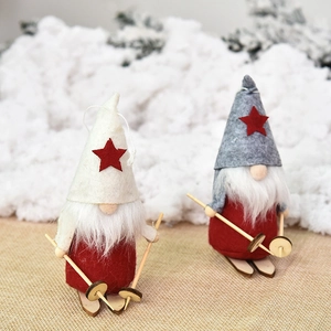 Nordic Christmas gnome skiing figurines with red star felt hats and wooden skis