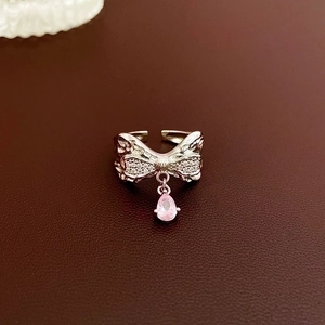 Silver bow ring with sparkling zircon and a delicate pink teardrop crystal pendant