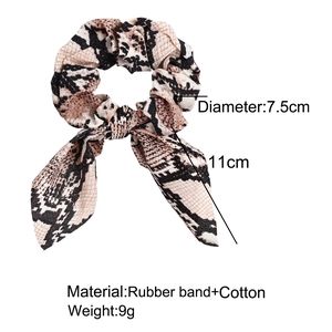 Leopard print scrunchie with bow details, dimensions 7.5cm diameter and 11cm ribbon length