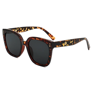 Fashionable oversized tortoise shell sunglasses with dark grey lenses and 45-degree side view