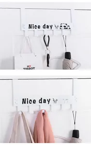 Detail of white carbon steel door hook rack featuring six hooks and panda decoration