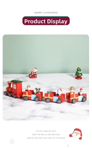 Detailed close-up of a red wooden Christmas train with miniature festive characters