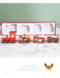 Detail of wooden Christmas train set with Santa figures in a festive gift packaging box