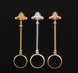 Detailed trio of bee-shaped cigarette ring holders in gold, silver, and rose gold finishes