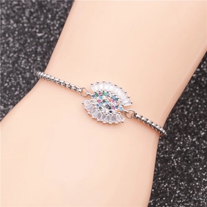 Detailed view of adjustable silver chain bracelet with colorful evil eye zircon pendant