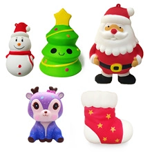 Detail view of five Christmas themed squishy toys including Santa, snowman and reindeer