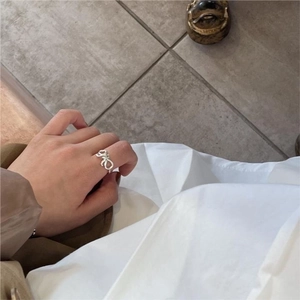 Minimalist 925 sterling silver bow knot ring with a stylish twisted wrap design