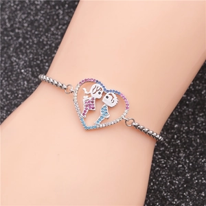 Detailed shot of an adjustable couple bracelet with a heart pendant and crystal accents