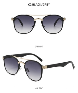 Detail view of retro oval sunglasses with black frames and golden double bridge design