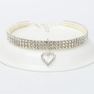 Detailed view of silver elastic pet choker with three-row rhinestones and heart pendant