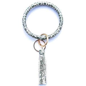 Close-up of leopard print leather keychain wristlet with golden ring and tassel