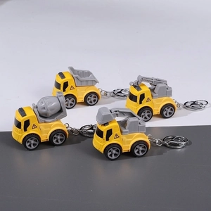 Set of four mini cartoon yellow construction vehicle keychains for kids school bags