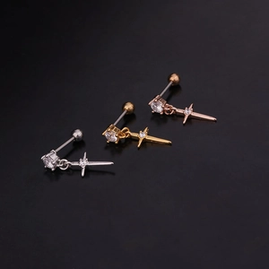 Detailed view of stainless steel cartilage studs in silver, gold, and rose gold with zircon stars