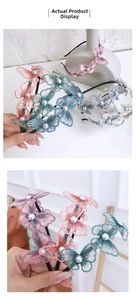 Detail of 3D embroidered butterfly headband with pearls and layered mesh texture