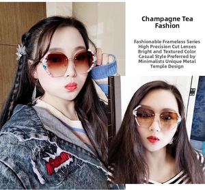 Close-up of rimless gradient sunglasses with luxury rhinestone trim and gold metal temples