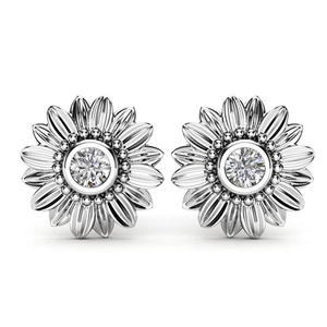 Macro shot of silver sunflower earrings featuring round center stones and textured petals