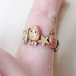 Artistic adjustable open ring featuring pink doll face and gold star with hand-painted finish