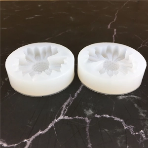 Daisy flower silicone mold for DIY resin jewelry making on black marble background