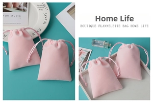 Close-up of pink plush velvet drawstring jewelry pouches with soft silk cord closure