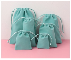Various sizes of tiffany blue velvet drawstring pouches for jewelry gift packaging