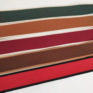 Detail showing five durable crossbody bag straps in various colors with twill weave texture