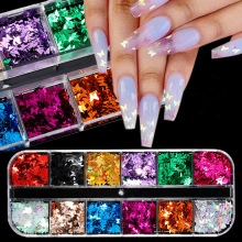 Detail view of 12-grid box with colorful butterfly nail art sequins and sample application