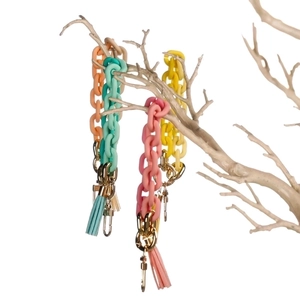 Colorful acrylic macaron link keychain with tassel and golden lobster clasp on white tree