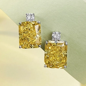 Macro shot of rectangular yellow high-carbon diamond earrings with S925 silver setting