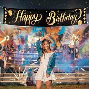 Festive black and gold Happy Birthday banner with balloons and stars for party decor
